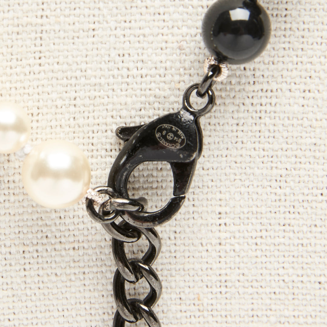 Pre-Loved Chanel™ Black & White Faux Pearl Necklace with Logo Detail