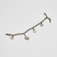 Excellent Pre-Loved Aged Champagne Gold Tone Chain Bracelet with Crystal Embellished iconic Charms.(front)