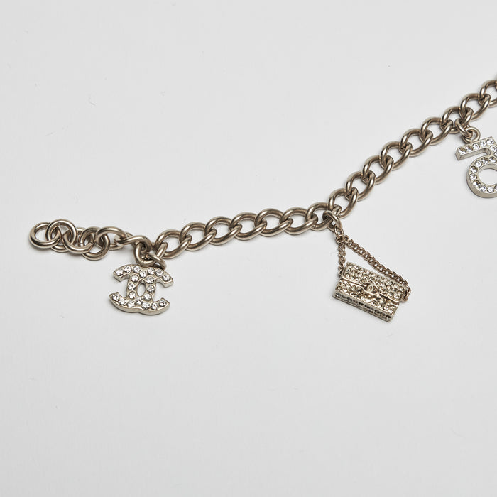 Excellent Pre-Loved Aged Champagne Gold Tone Chain Bracelet with Crystal Embellished iconic Charms.(charms)