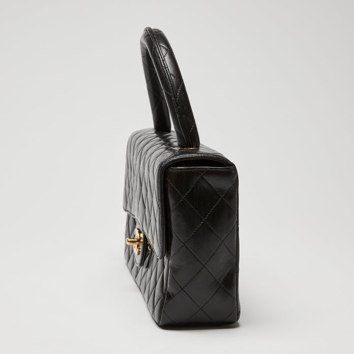 Pre-Loved Chanel™ Black Quilted Lambskin Leather Vintage Top Handle Flap Bag