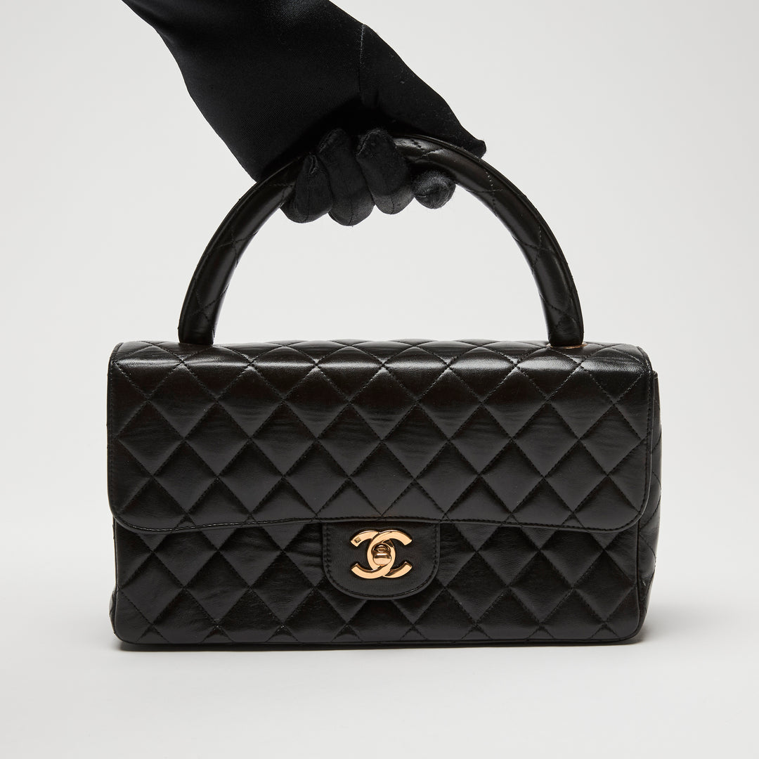 Pre-Loved Chanel™ Black Quilted Lambskin Leather Vintage Top Handle Flap Bag