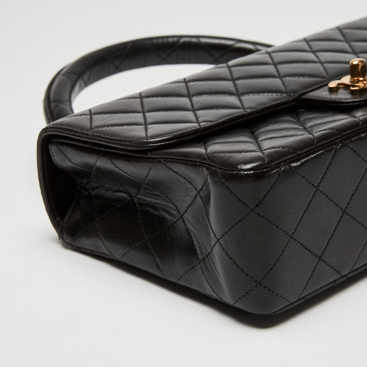 Pre-Loved Chanel™ Black Quilted Lambskin Leather Vintage Top Handle Flap Bag
