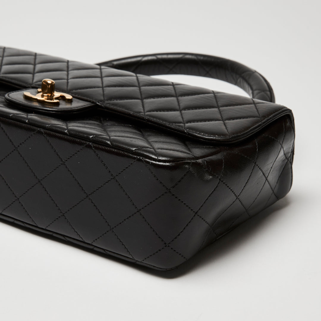 Pre-Loved Chanel™ Black Quilted Lambskin Leather Vintage Top Handle Flap Bag