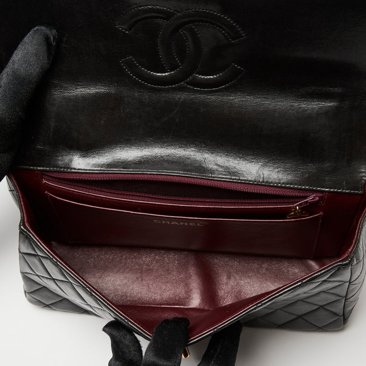 Pre-Loved Chanel™ Black Quilted Lambskin Leather Vintage Top Handle Flap Bag