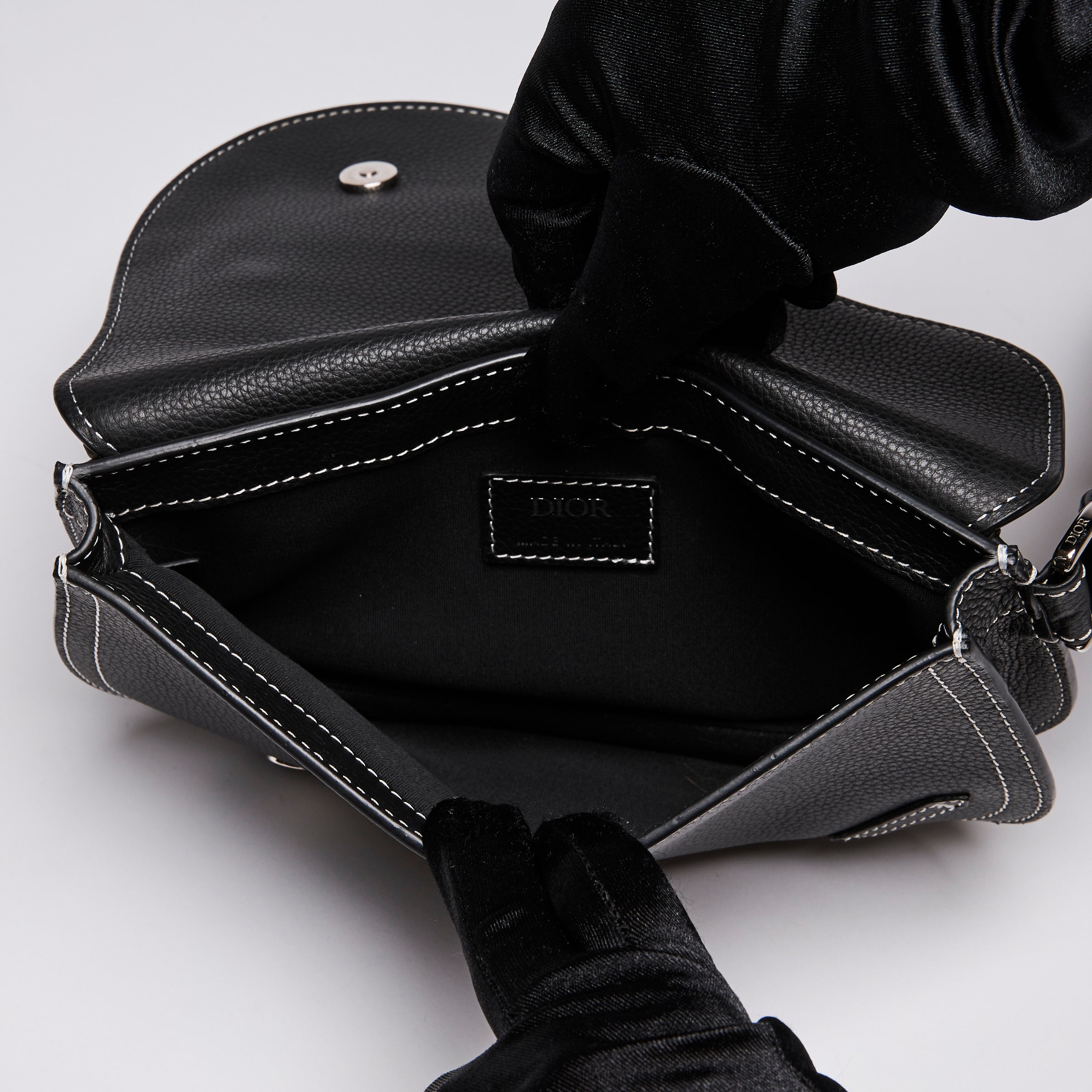 Dior X KAWS Small Black Pebbled Leather Saddle Bag with
