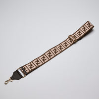 Excellent Pre-Loved Brown and Light Pink Fabric Adjustable Guitar Strap with Gold Tone Hardware. (front)