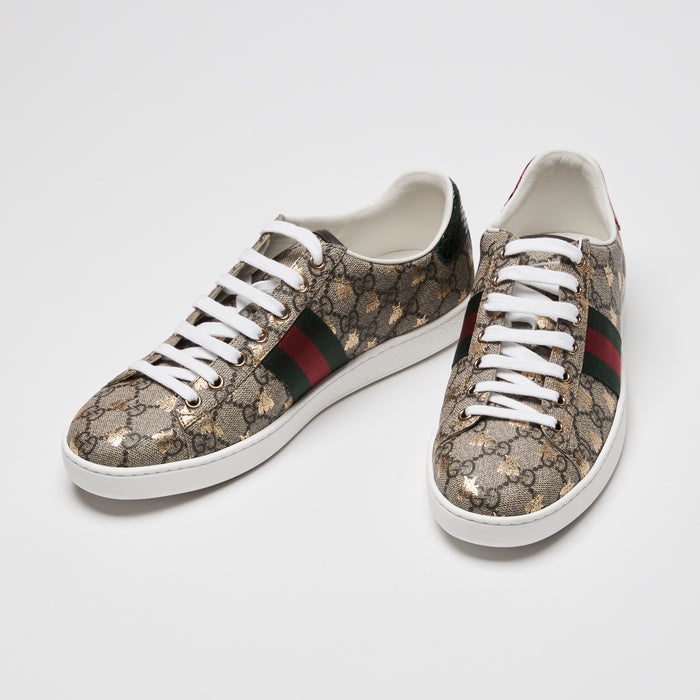 Pair of Gucci Ace sneakers in GG supreme canvas with gold printed bee motif, green and red web 