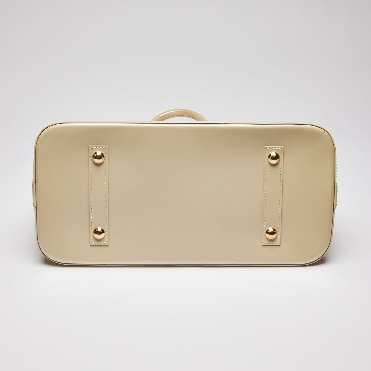 Pre-Loved Large Monogram Embossed Ivory Patent Leather Half Dome Shaped Top Handle Bag. (bottom)