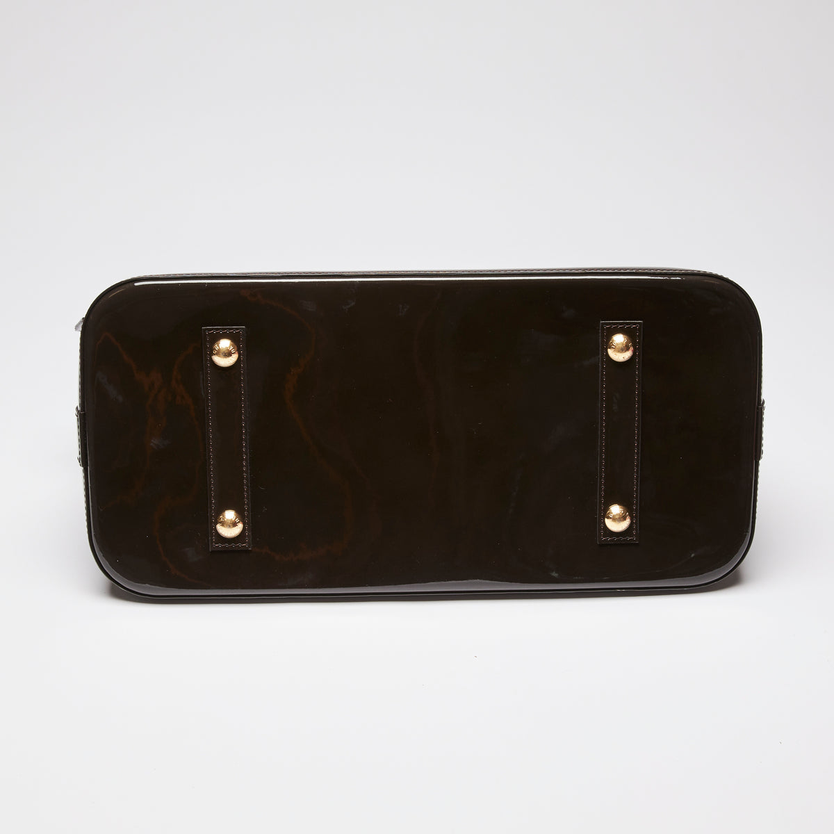 Pre-Loved Dark Plum Monogram Embossed Patent Leather Top Handle Bag. (bottom)