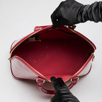 Pre-Loved Large Monogram Embossed Red Patent Leather Half Dome Shaped Top Handle Bag. (interior)