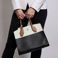 Excellent Pre-Loved Ivory/Dark Beige/Black Smooth Leather Top Handle Bag. (on body)