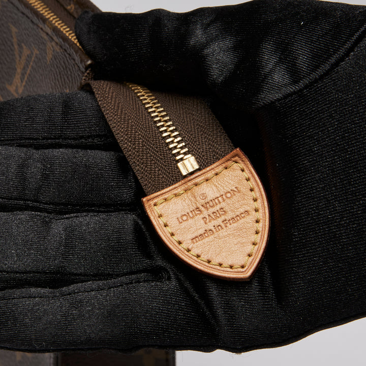Excellent Pre-Loved Monogram Coated Canvas Toiletry Pouch. (leather tab)