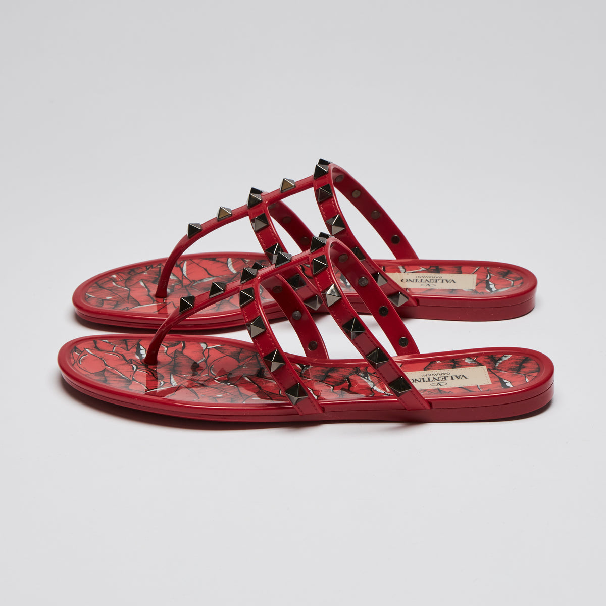 Pre-Loved Red Jelly Dark Silver Tone Studded Thong Sandals. (side)