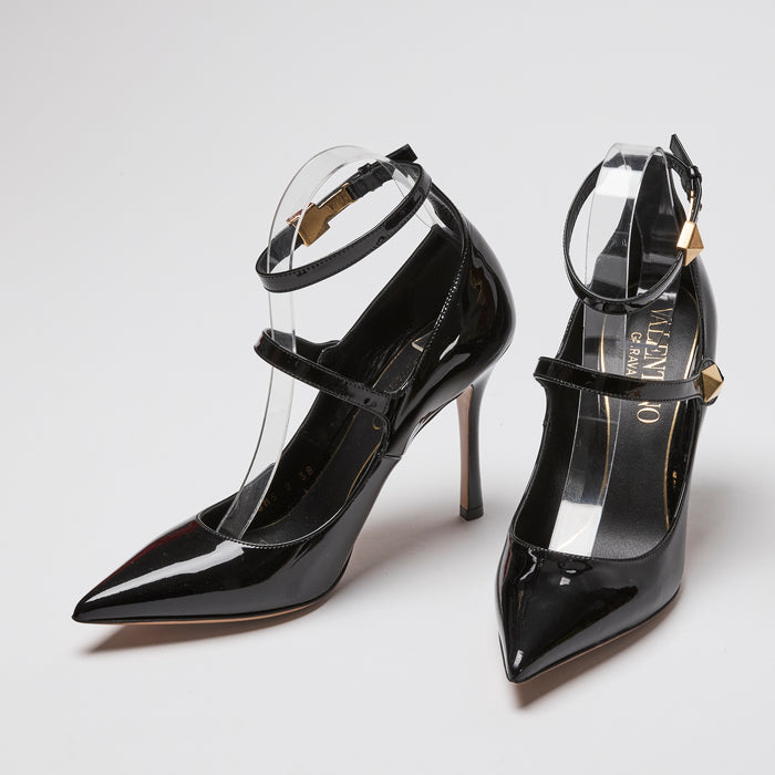 Valentino high-heeled pumps in black patent leather with gold rockstud ankle straps